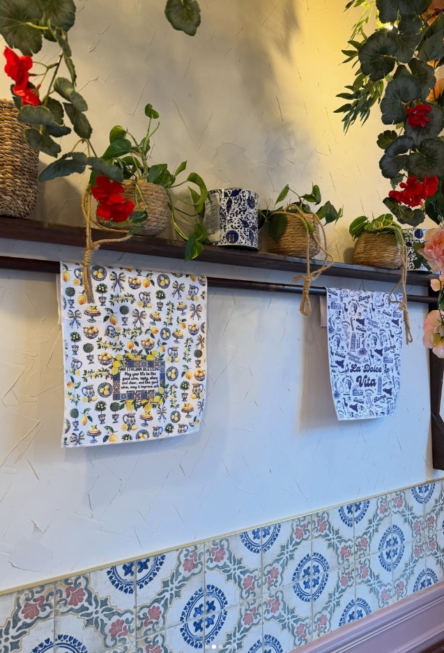 Sicilian tiles, plants and flowers inside Norma